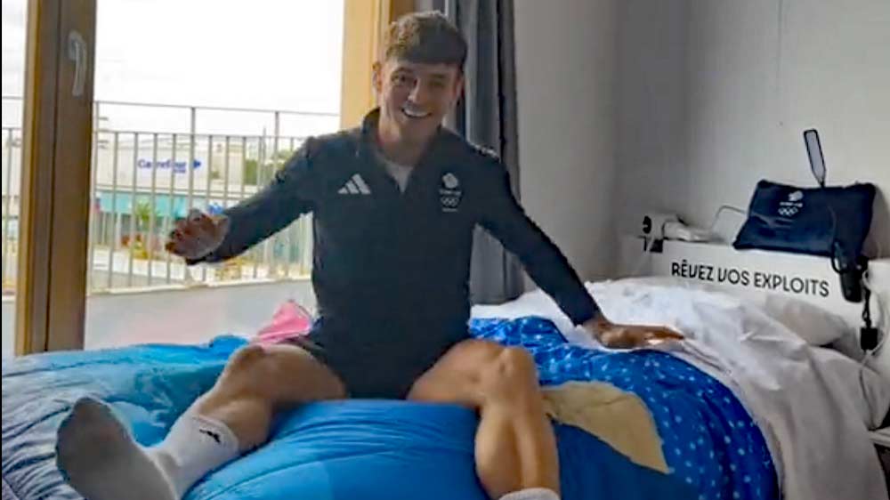 Watch: Tom Daley Investigates 'Anti-Sex Beds' at the Olympic Village in Paris